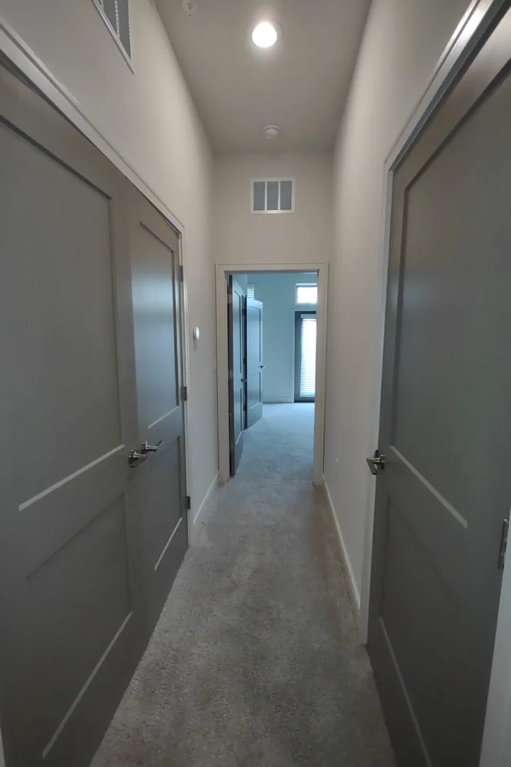 Hallway with freshly painted walls and doors in a modern home