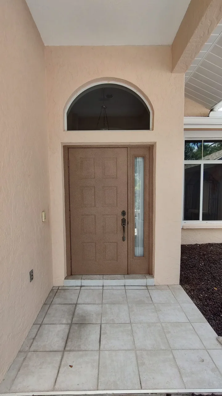 Front entrance of a house with freshly painted door and walls